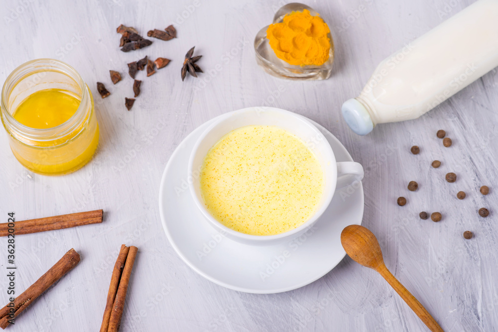 moon milk with turmeric, yellow Vedic milk with spices, honey, cinnamon, anise and pepper, vegan food moon milk with turmeric, yellow Vedic milk with spices, honey, cinnamon, anise and pepper, vegan food