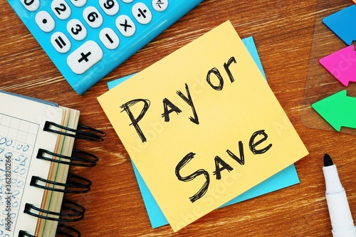 Business concept about Pay Or Save with sign on the piece of paper.