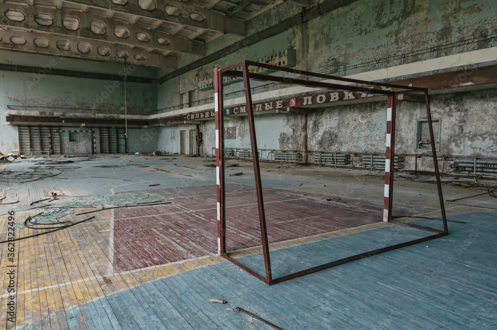 Playing field in gym in Prypiat, Chernobyl exclusion Zone. Chernobyl Nuclear Power Plant Zone of Alienation in Ukraine Playing field in gym in Prypiat, Chernobyl exclusion Zone. Chernobyl Nuclear Power Plant Zone of Alienation in Ukraine