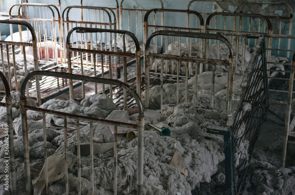 Toys and cots, Kindergarten in Prypiat, Chernobyl exclusion Zone. Chernobyl Nuclear Power Plant Zone of Alienation in Ukraine