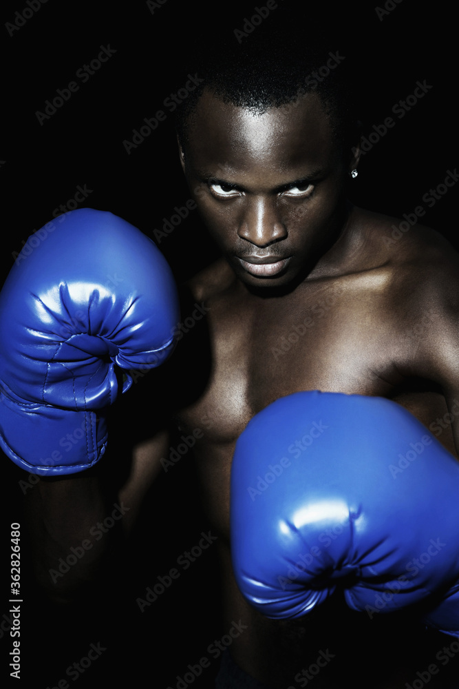 Man with blue boxing gloves