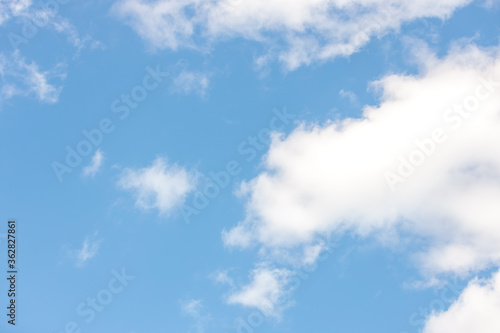 Summers day fluffy clouds with blue sky