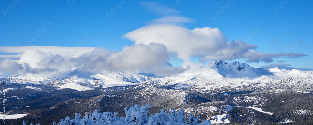 Panoramic view of the Three Sisters Mountains on a winter day in central Oregon.