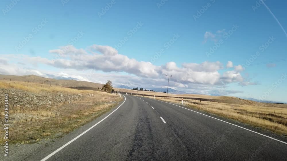 Scene of road trip in the car while moving forward on the beautiful scenic view of South Island New Zealand. Scene of road trip in the car while moving forward on the beautiful scenic view of South Island New Zealand.