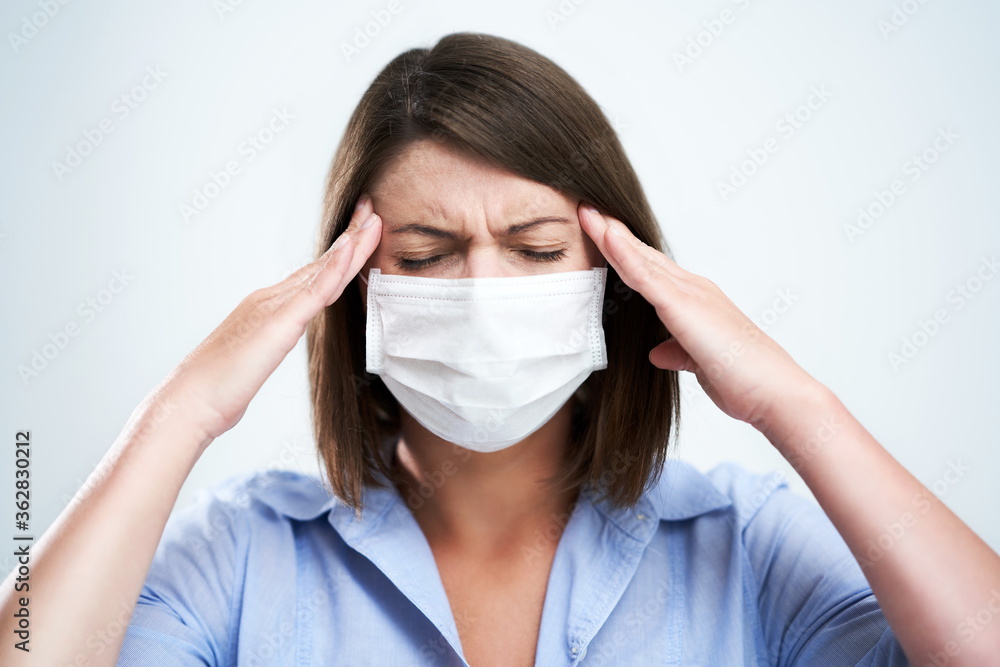 Attractive woman wearing protective mask isolated over white background Attractive woman wearing protective mask isolated over white background
