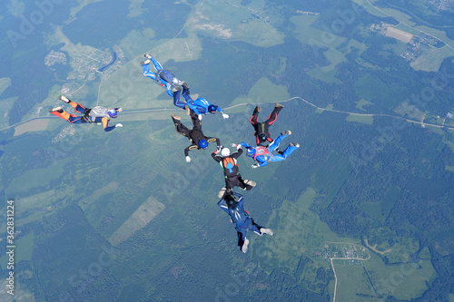 Skydiving. Formations. A group of skydivers is in the sky.