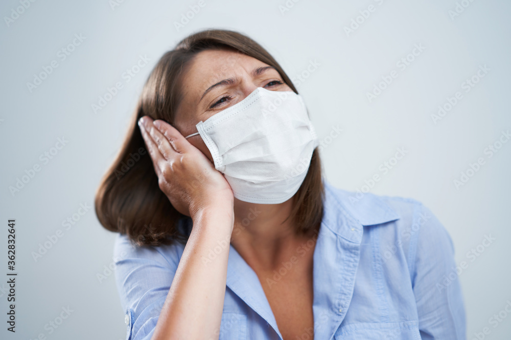 Attractive woman wearing protective mask isolated over white background Attractive woman wearing protective mask isolated over white background