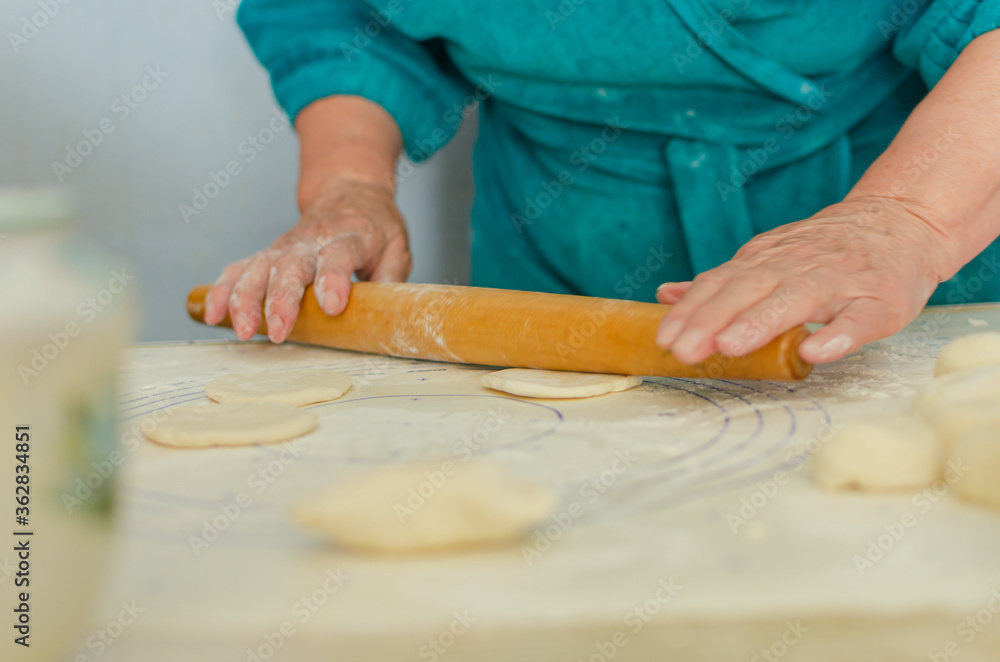 process of sculpting home-made pierogi. Grandma prepares a national Ukrainian dish - vareniki.