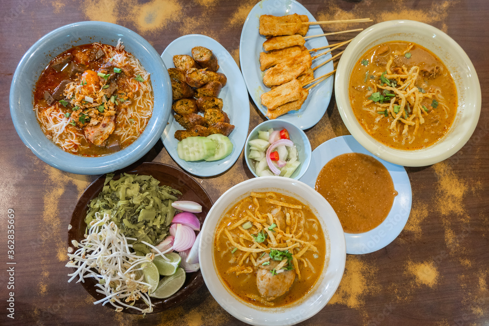 Northern Style Thai Food background,Khao Soi Kai,Nam ngiao Rice Noodle,Northern Thai Sausage. Northern Style Thai Food background,Khao Soi Kai,Nam ngiao Rice Noodle,Northern Thai Sausage.