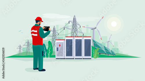 Electrician technician engineer man diagnostics electricity power supply grid transmission. Person inspection production facility. Renewable solar panel wind energy plant with battery storage. 