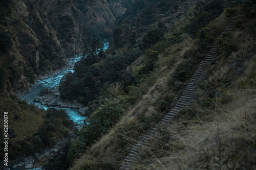 Beautiful Marshyangdi river flowing through a canyon valley underneath rock stairs, Annapurna circuit, Nepal