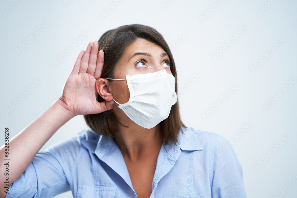 Attractive woman wearing protective mask isolated over white background Attractive woman wearing protective mask isolated over white background