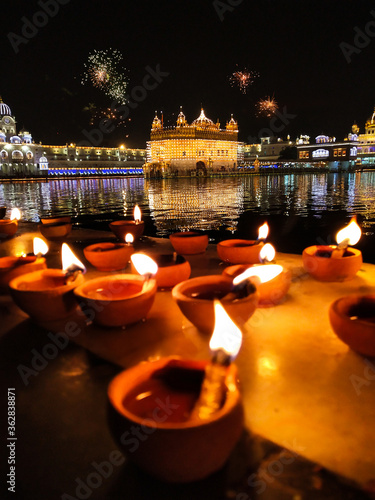 Golden Temple Amritsar lit by Diya and fire crackers Guru Purab festival and Diwali 