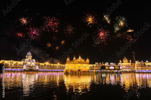 Golden Temple Amritsar lit by Diya and fire crackers Guru Purab festival and Diwali  photo