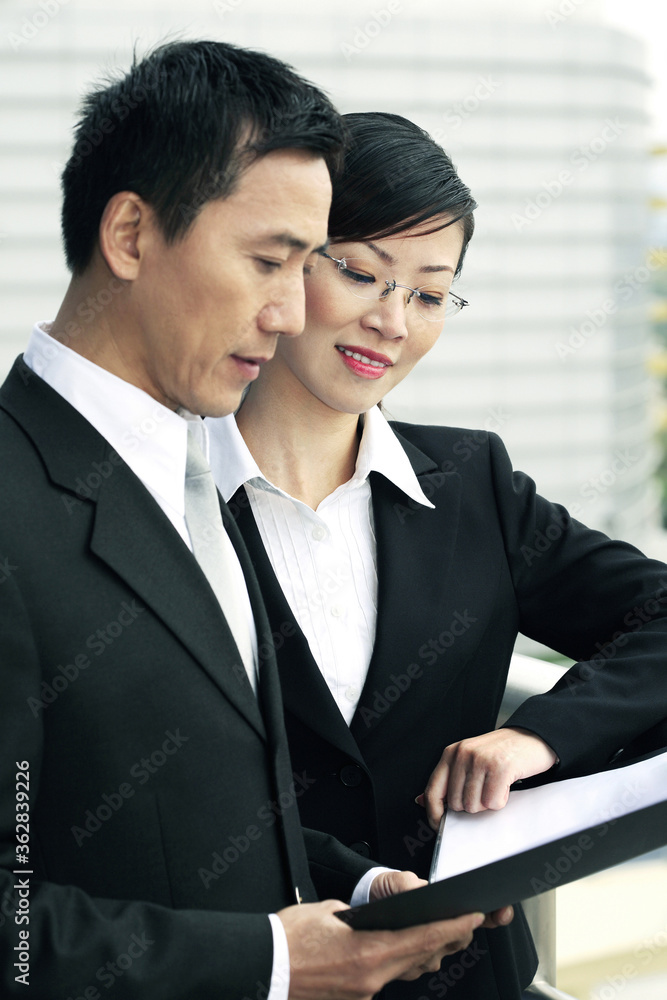 Businessman and businesswoman having discussion