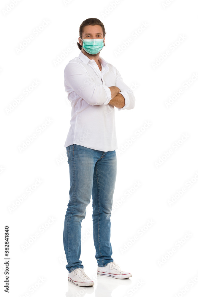 Handsome Man Is Standing With Arms Crossed And Looking At Camera Handsome Man Is Standing With Arms Crossed And Looking At Camera