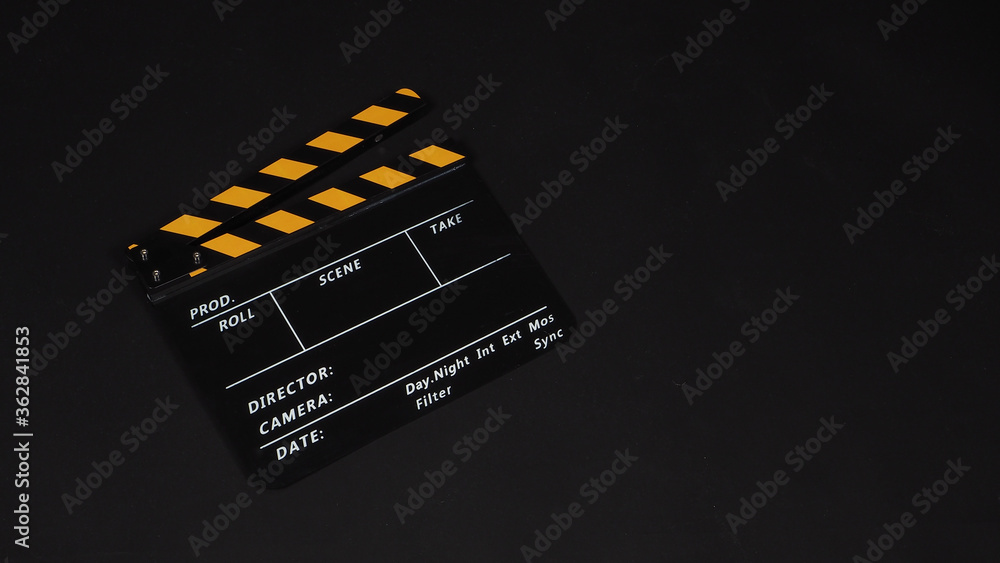 Clapperboard or movie slate on black background.it use in video production and film industry .