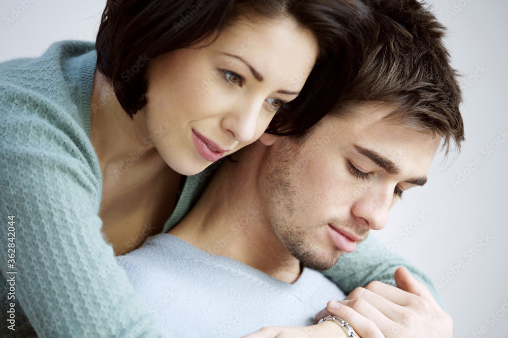 Woman hugging her boyfriend from behind Woman hugging her boyfriend from behind