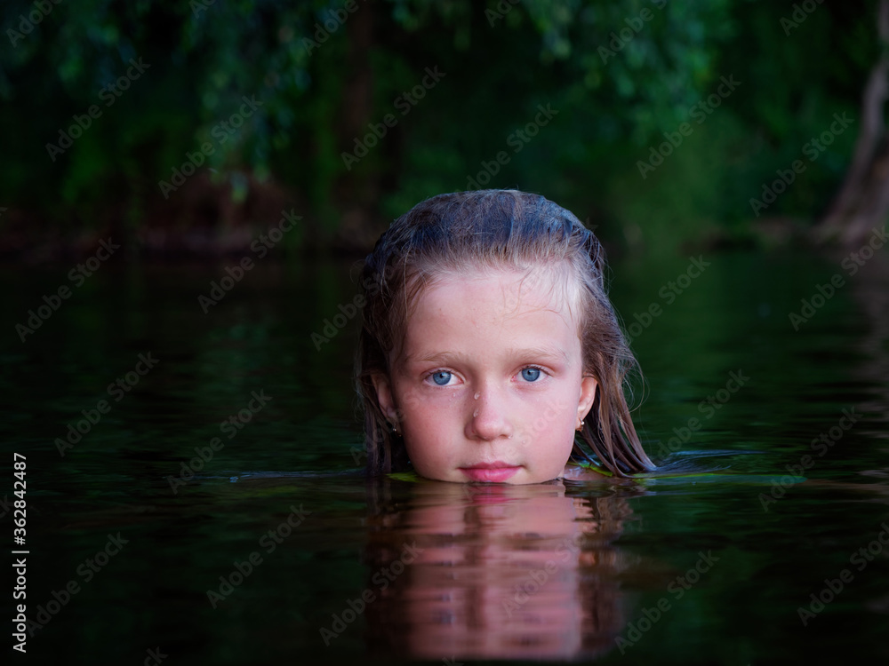 Fototapeta premium mermaid girls with blue eyes and wet hair in dark water