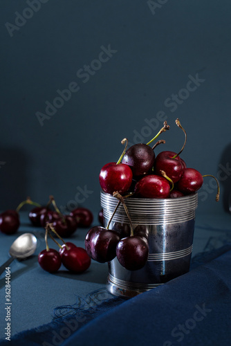 Obraz na płótnie Red Cherries On Stainless Steel Pot  photography