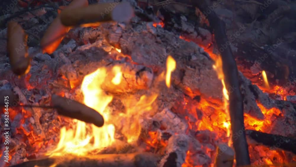 Roasting sausages on the bonfire in slow motion 180fps Roasting sausages on the bonfire in slow motion 180fps