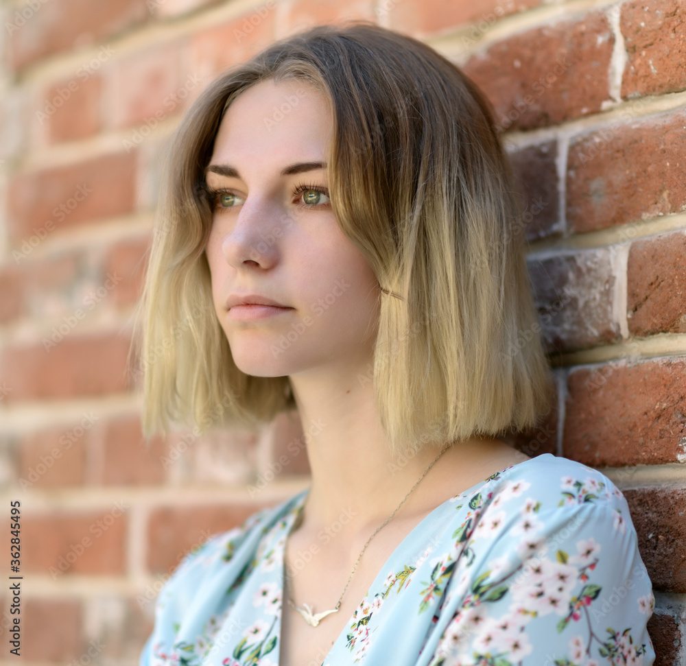 Outdoors portrait of beautiful young woman with green eyes. Outdoors portrait of beautiful young woman with green eyes.