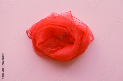 woman red scarf, symbol of vulva, clitoris, vagina, erotic minimal concept, top view, flat lay