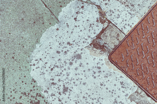 detail of the pavement with metallic rust cover photo