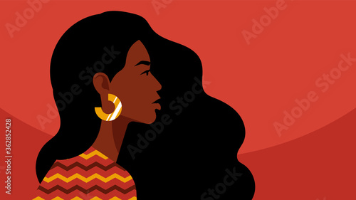 Beautiful black woman. Young african american. Portrait of young woman with beautiful face and hair. Side view. Isolated on a pink background.