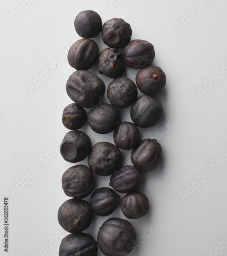 Top view shot of dried lime on white background.
loomi, limoo amani, black lime, persian lime photo