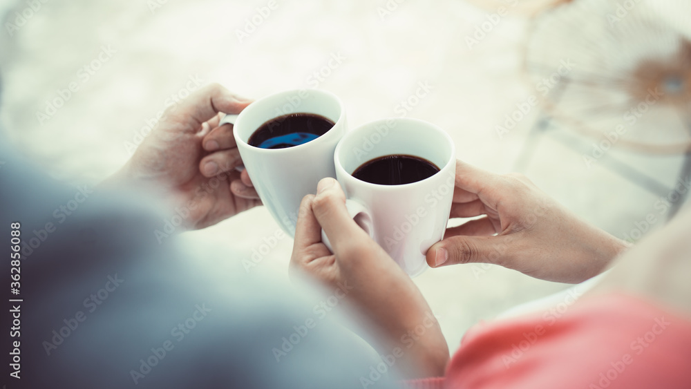 Close up of couple hands holding coffee Close up of couple hands holding coffee