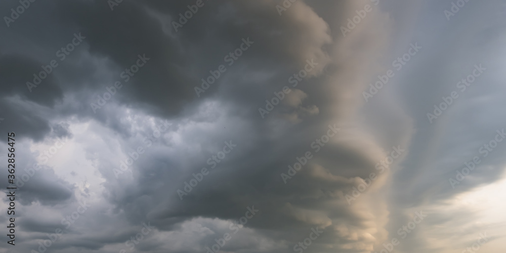 Fototapeta premium panorama of black sky background with storm clouds. thunder front