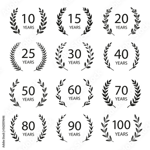 Set of anniversary laurel wreaths. Black and white anniversary symbols. 10, 15, 20, 25, 30, 40, 50, 60, 70, 80, 90, 100 years. Template for award and congratulation design. Vector illustration.
