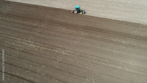 Farmers use rotary tillers to level the land and prepare for sowing, North China