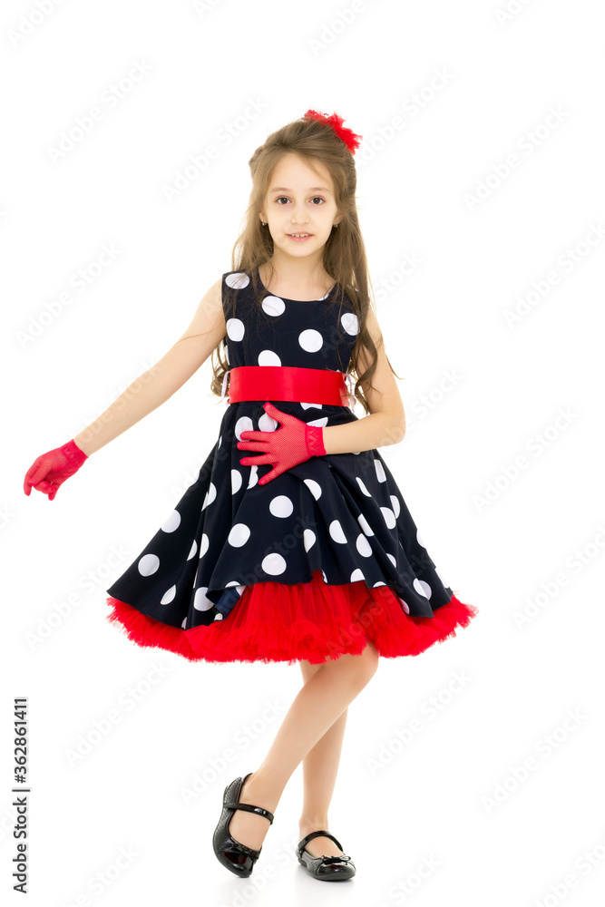 Full Length Portrait of Pretty Girl in Polka Dot Dress