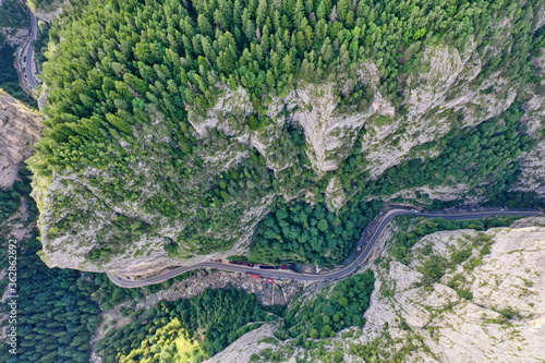 Winding road in mountain canyon from above