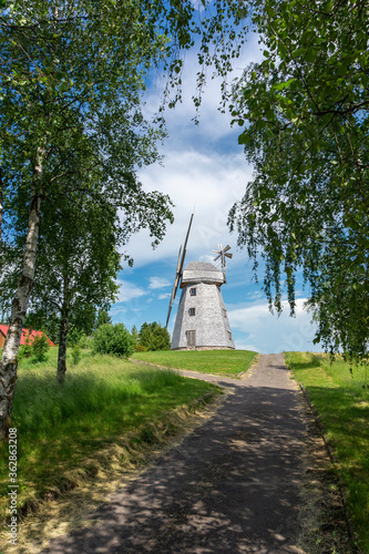 Country road leading to an old tower mill