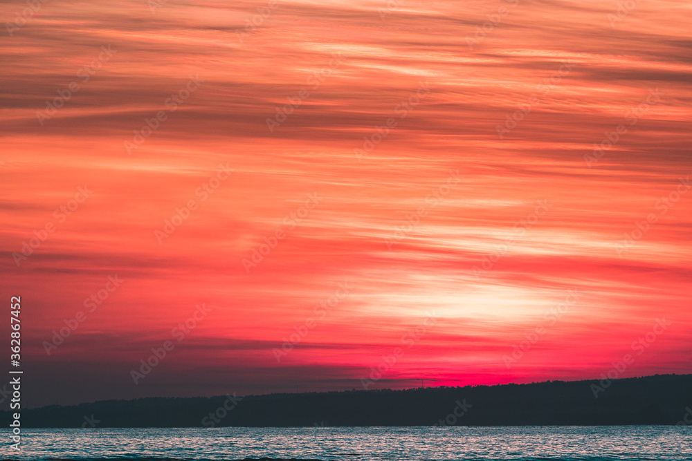 Abstract of red and golden sunrise and soft clouds