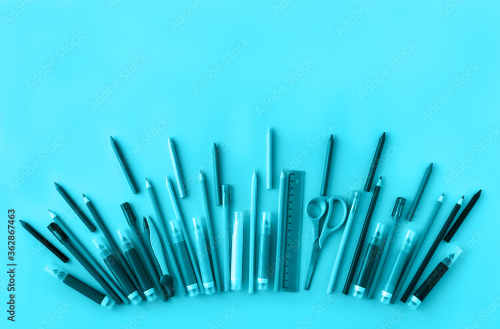 School supplies background in trendy aqua color. Back to school concept. Flat lay. Top view. Backdrop for your design. Copy space. School supplies background in trendy aqua color. Back to school concept. Flat lay. Top view. Backdrop for your design. Copy space.