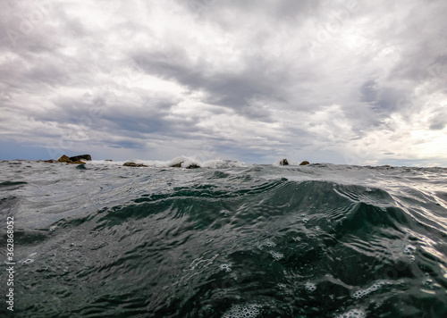 view of the ligurian coast. high sea waves