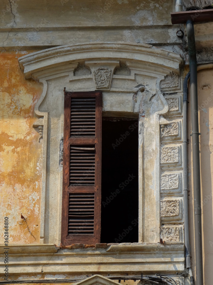 Fototapeta premium Beautiful old window frame with missing shutter