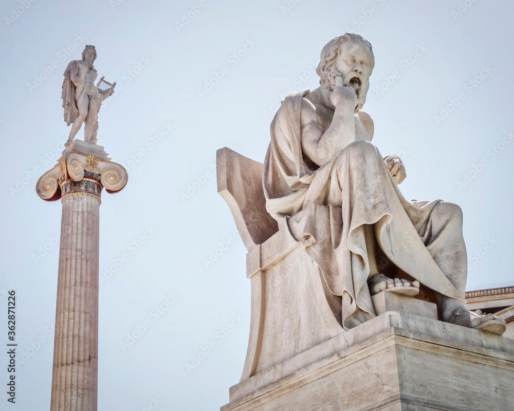 Socrates the philosopher and Apollo god of the arts marble statues, Athens Greece
