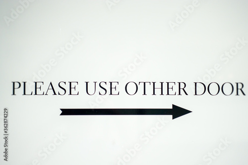 Please use other door sign in black and white