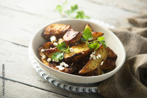 Roasted potato wedges with Feta cheese