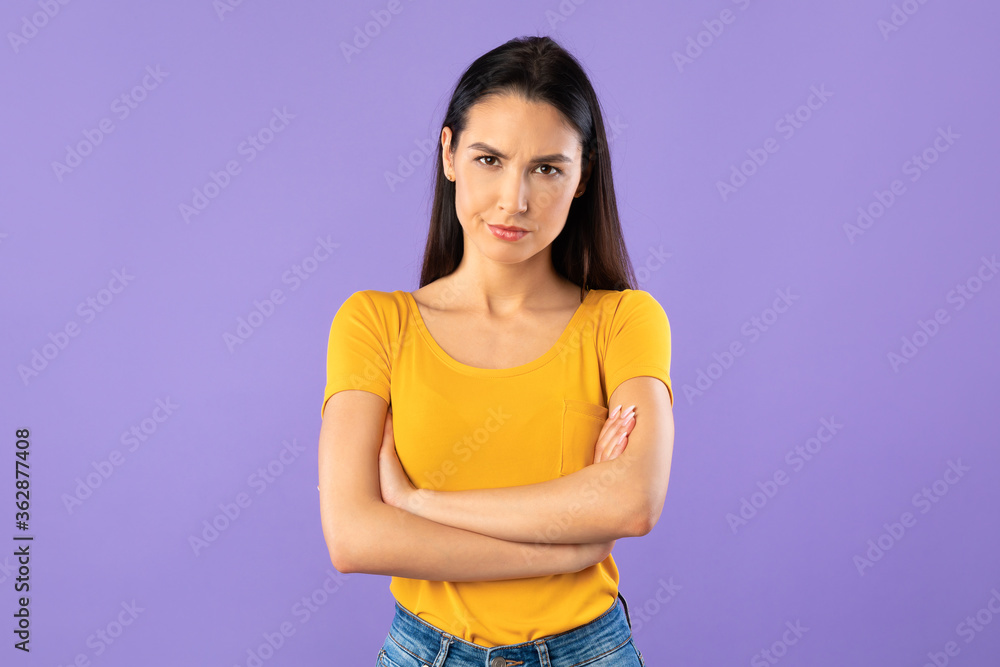 Portrait of offended woman with folded arms Portrait of offended woman with folded arms