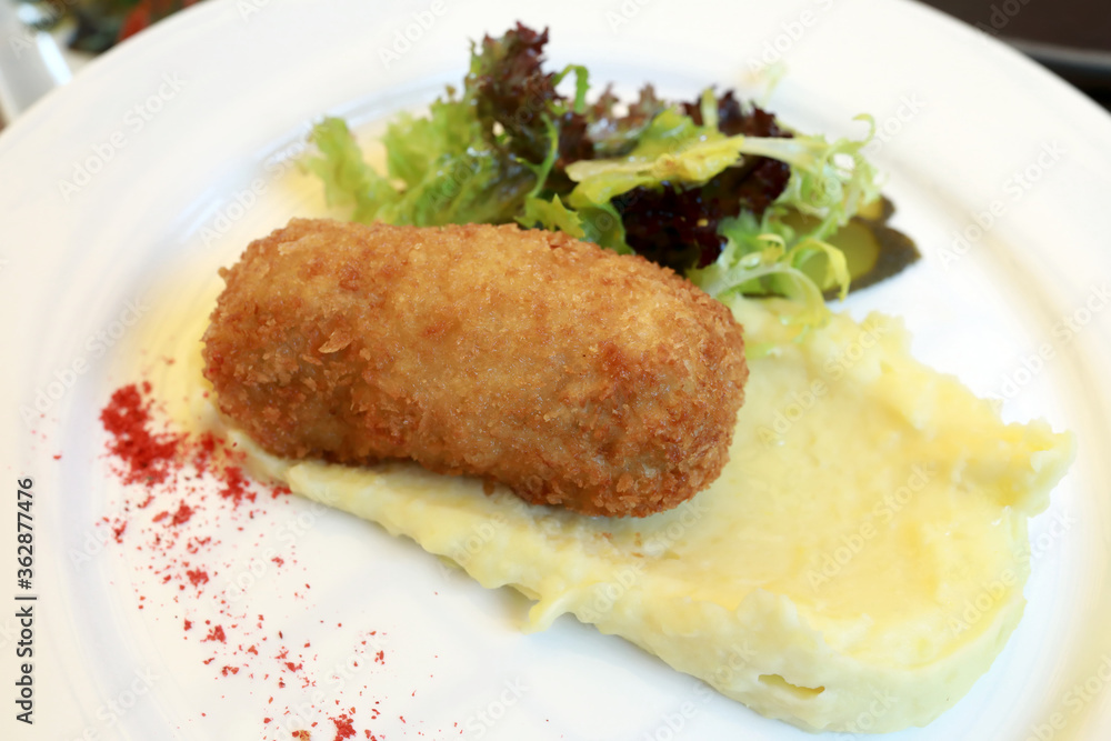 Chicken Kiev with mashed potatoes on plate