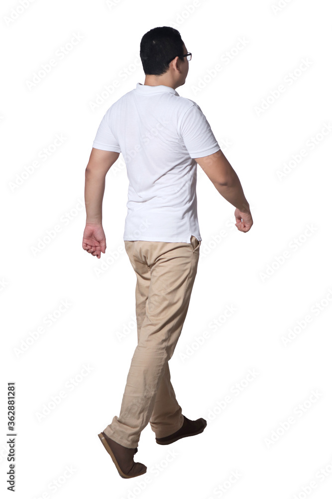 Naklejka premium Full length portrait of Asian man wearing white shirt and khaki jeans standing walking, rear view