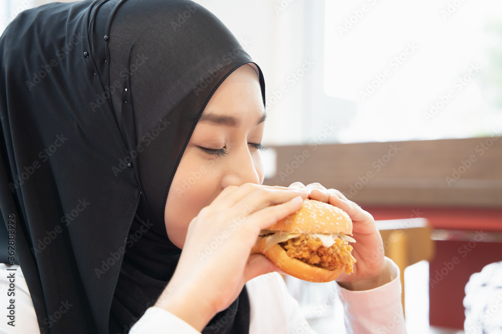 Hungry Islamic Woman Looking Eating Halal Fried Chicken Burger Concept Of Delicious Halal Food