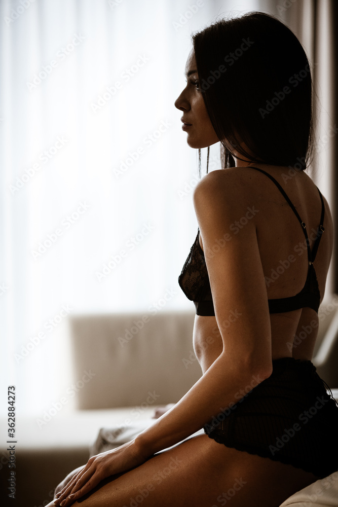 Beauty of woman body and lingerie concept. Beautiful brunette female  fashion model in sexy black underwear