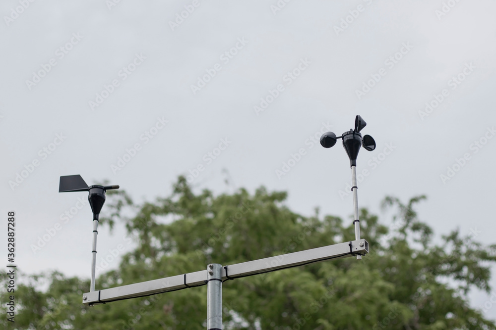 Wind speed and direction meter with sky background. Wind speed and direction meter with sky background.